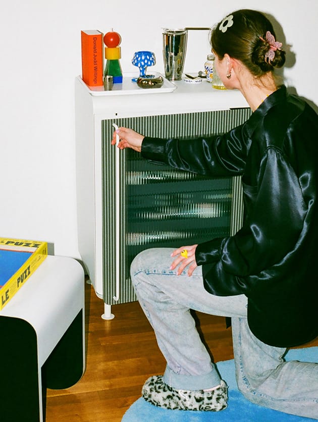 Opening the door of the Rocco Fridge in white.