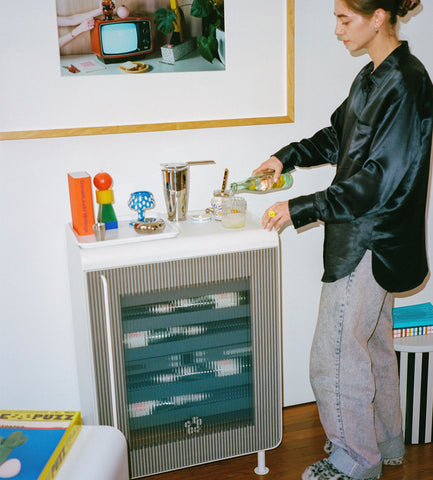Serving a drink on top of the Rocco Fridge