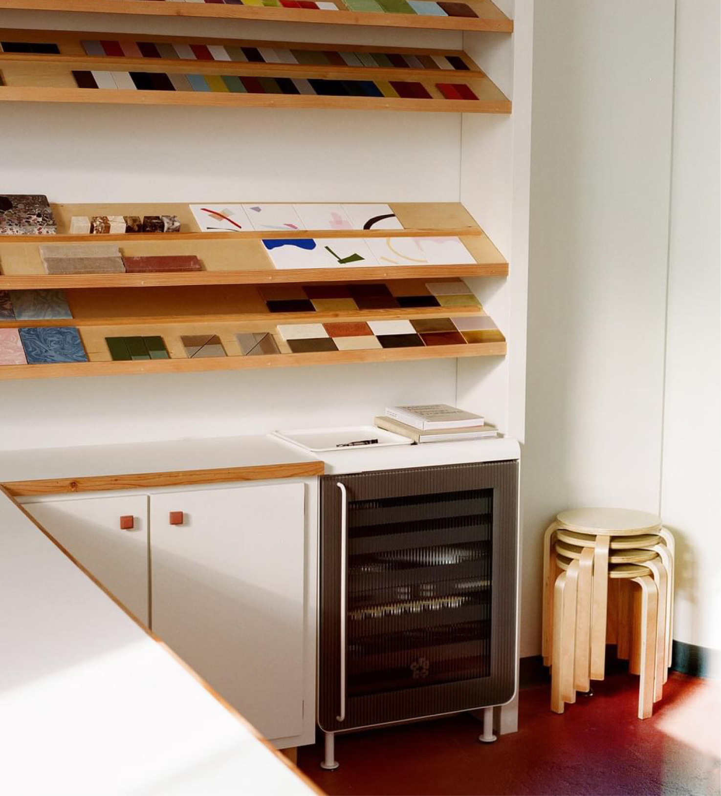 The Rocco Fridge in white placed in a design studio.