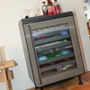 Closed Graphite Rocco fridge in a living room.